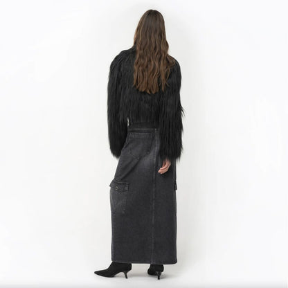 Back view of a model wearing PINKO Black Cotton Skirt with zip closure, back pockets, and side pockets.