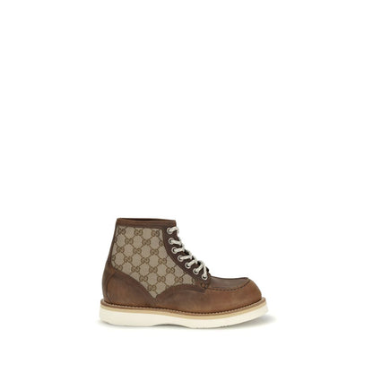 Gucci Brown Leather Lace-Up Boots with GG fabric insert, showcasing iconic design and durable Goodyear construction.