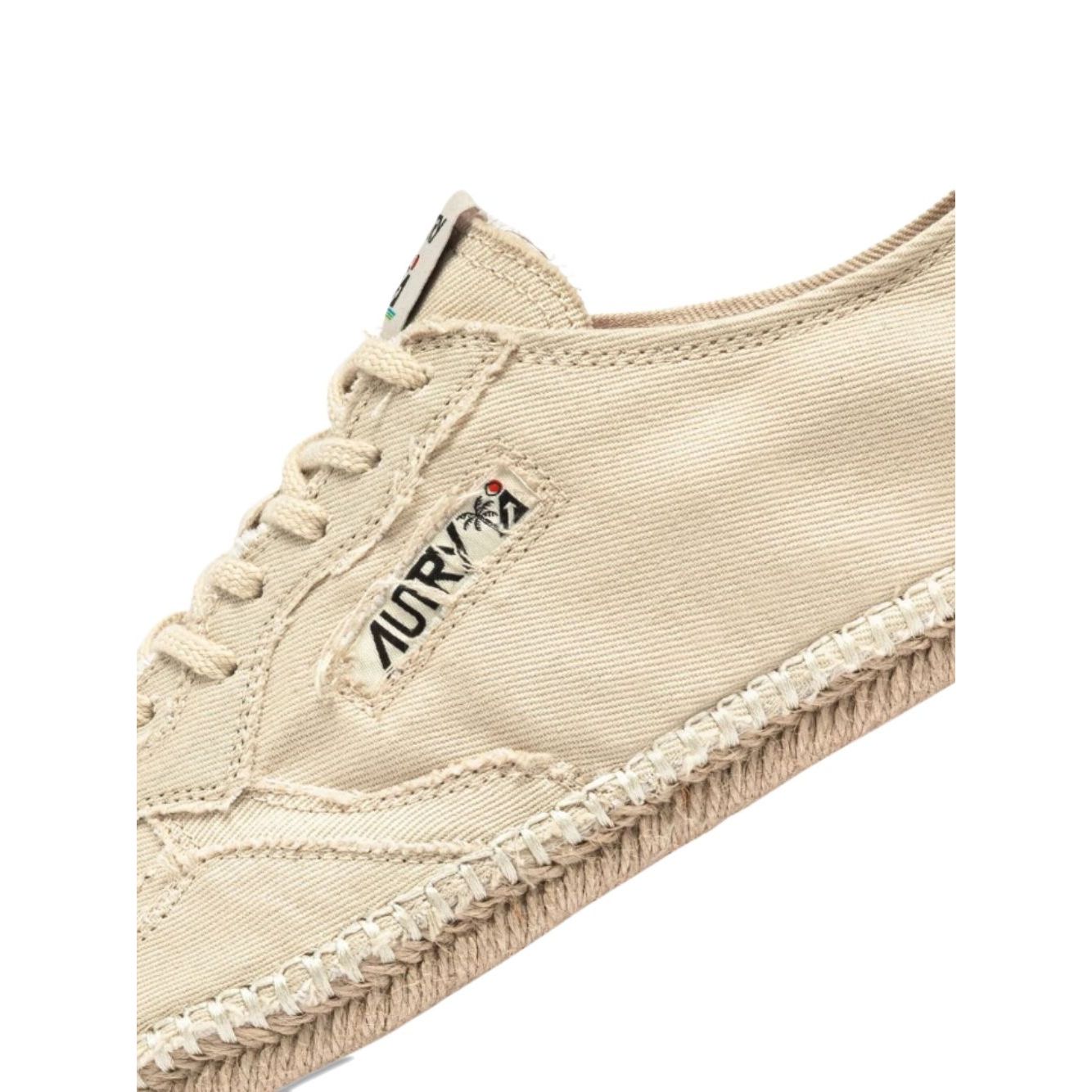 AUTRY Sneakers Ivory with beige jute sole and canvas upper, lace-up style, showcasing logo patch and tonal stitching.