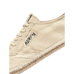 AUTRY Sneakers Ivory with beige jute sole and canvas upper, lace-up style, showcasing logo patch and tonal stitching.