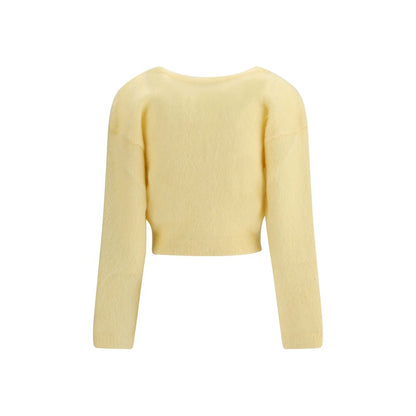 Back view of Alessandra Rich Yellow Mohair Cardigan showcasing its soft texture and retro design, perfect for a stylish autumn wardrobe.
