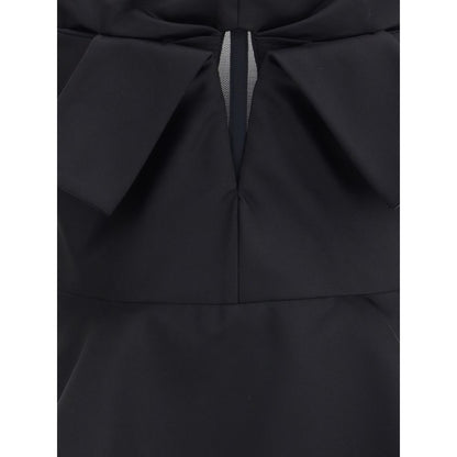 Alexander McQueen Black Polyester Top with bow detail and peplum hem.