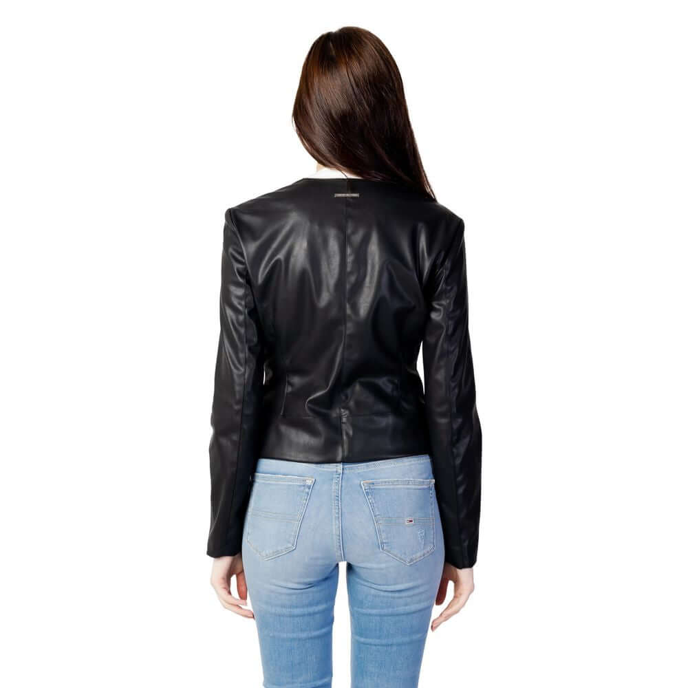 Man wearing Armani Exchange Black Polyester Jackets & Coat, showcasing stylish back view in an urban setting.