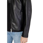 Close-up of Armani Exchange Black Polyester Jackets & Coat on model wearing blue jeans