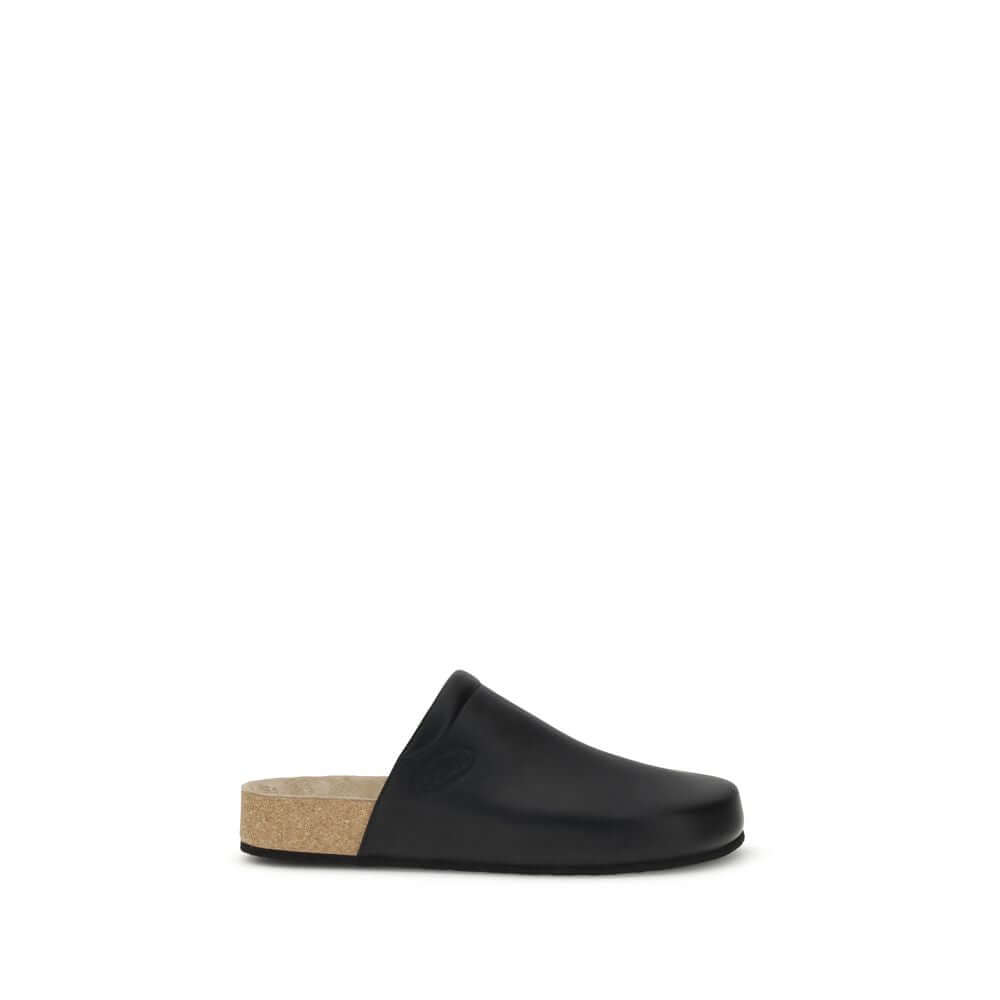 Balenciaga Black Calf Leather Bos Taurus Mules with cork insole, offering modern style and natural comfort.