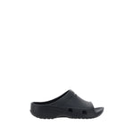 Balenciaga Eva Sandals in rubber, featuring an open toe design with embossed logo on the strap. Season: SS25. Composition: 100% Rubber.