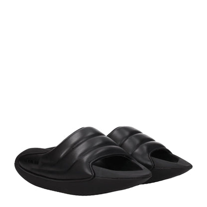 Balmain Black Leather Slippers with open toe design and side logo, featuring mid heels and rubber sole, style for casual wear.