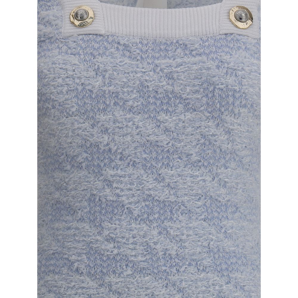 Close-up of Balmain Light Blue Polyamide Casual Dress with ribbed neckline and embossed button details, showcasing texture.