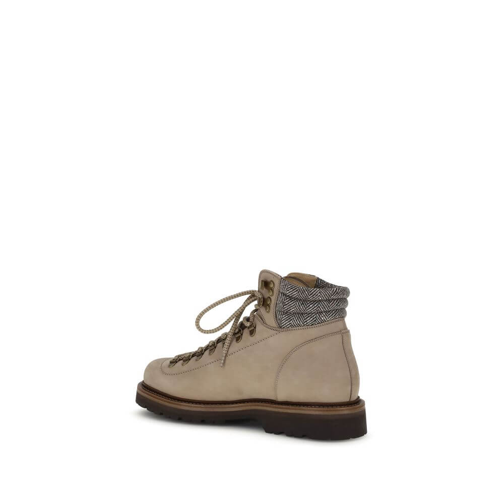 Brunello Cucinelli Beige Calf Leather Bos Taurus Lace-Up Boots with metal eyelets and two-tone laces, side view.