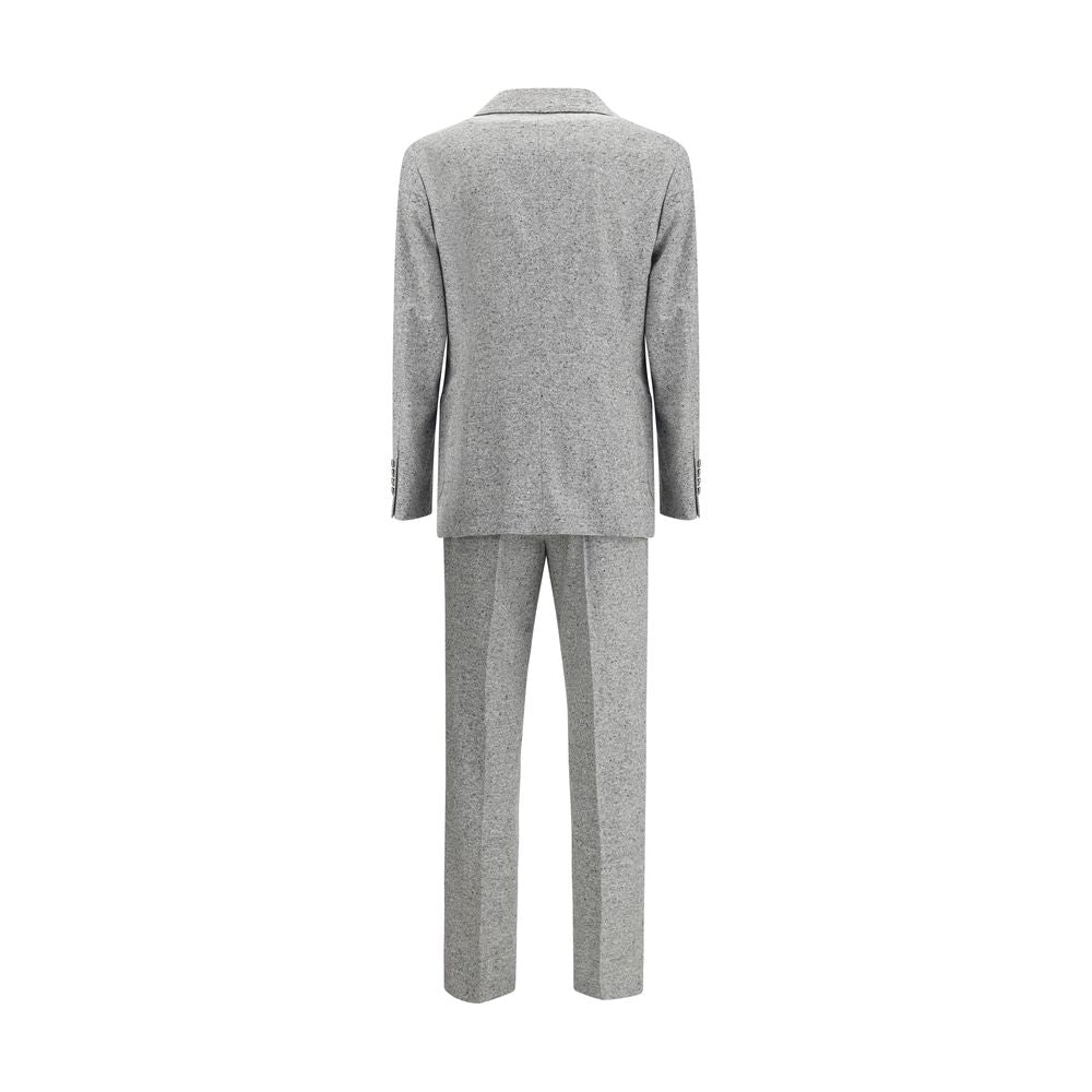 Brunello Cucinelli Gray Wool Two-Piece Suit - rear view of jacket and trousers, featuring metal buttons and peaked lapels.