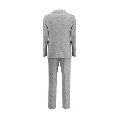 Brunello Cucinelli Gray Wool Two-Piece Suit - rear view of jacket and trousers, featuring metal buttons and peaked lapels.