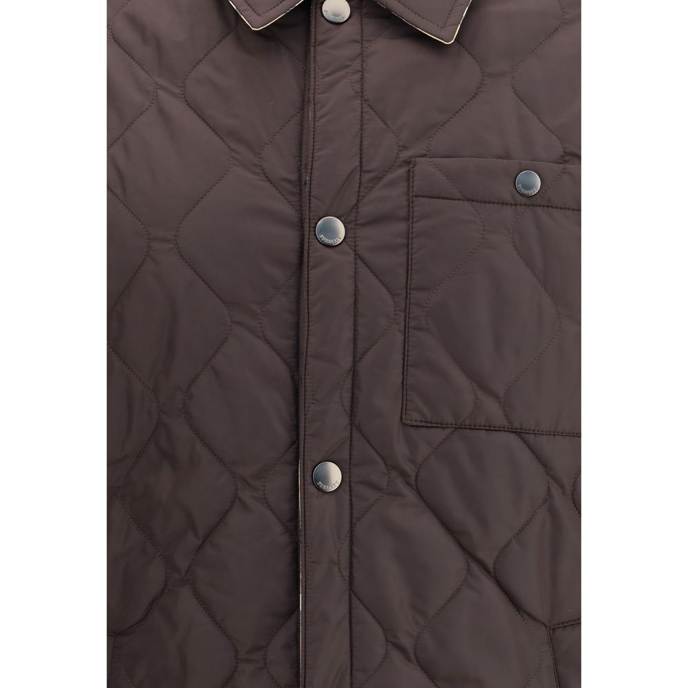 Close-up of Burberry Brown Polyamide Coat with quilted pattern, snap buttons, and a buttoned patch pocket on the chest.