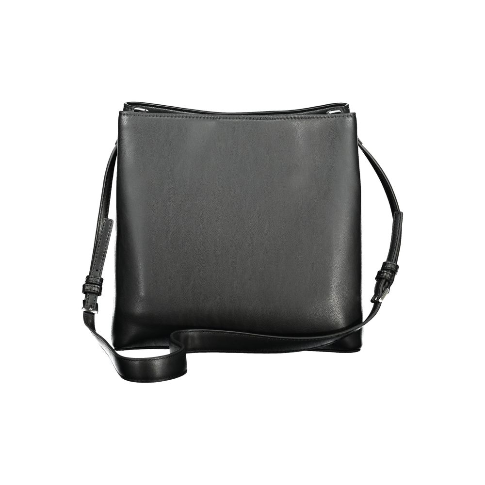 Calvin Klein Black Polyester Handbag with adjustable strap and twist-magnet closure, featuring two compartments and internal pockets