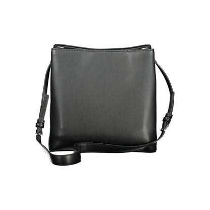 Calvin Klein Black Polyester Handbag with adjustable strap and twist-magnet closure, featuring two compartments and internal pockets