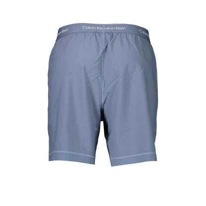 Calvin Klein Blue Polyester Pant, sports short with elastic waist, breathable fabric, two pockets, and logo print detail.