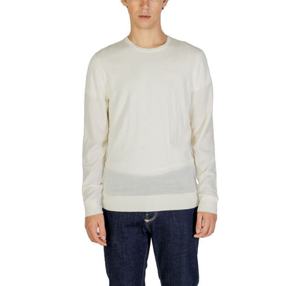 Calvin Klein Cream Recycled Wool Sweatshirt with crew neck, regular fit, showcased by male model in jeans.