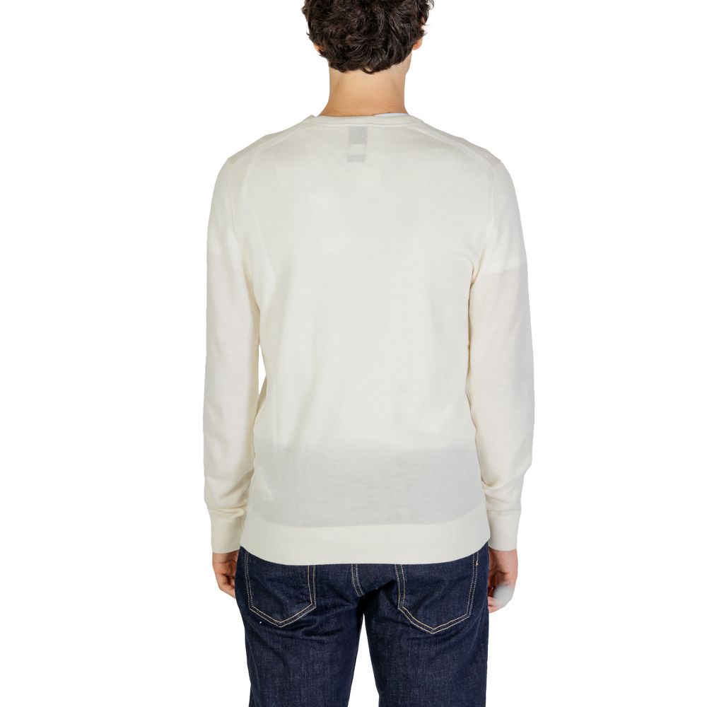 Back view of a man wearing a Calvin Klein Cream Recycled Wool Sweatshirt, highlighting its classic crew neck and ribbed finishes.