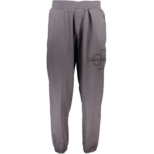 Calvin Klein Gray Cotton Pant featuring elastic waist, ankle cuffs, embroidery, and logo design. Made of 50% transitional cotton.