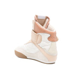 Alt Tag: Light beige Chloé Chloè Kick leather sneakers with touch-strap and logo patch on round toe, featuring rubber sole and 0.6-inch heel.