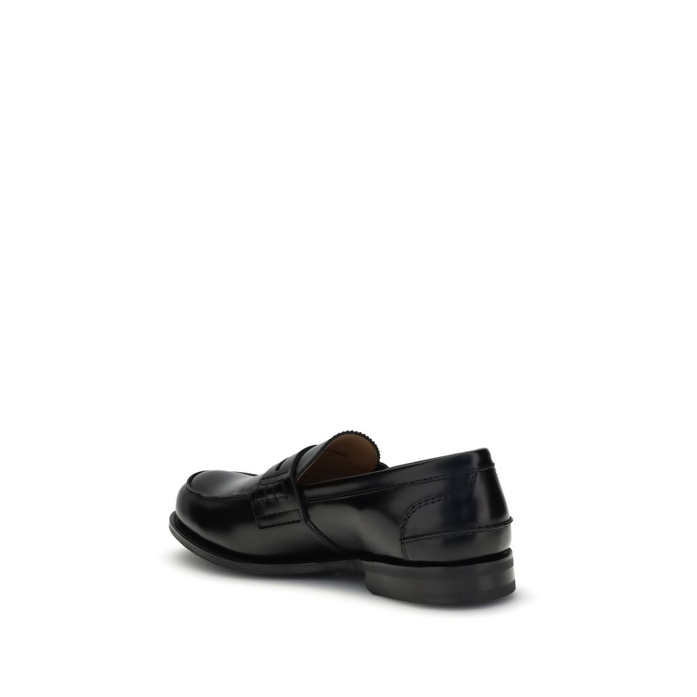 Church's Black Calf Leather Bos Taurus Slip-On Loafers with hand-stitched sides and smoked finish, showcasing elegant craftsmanship.