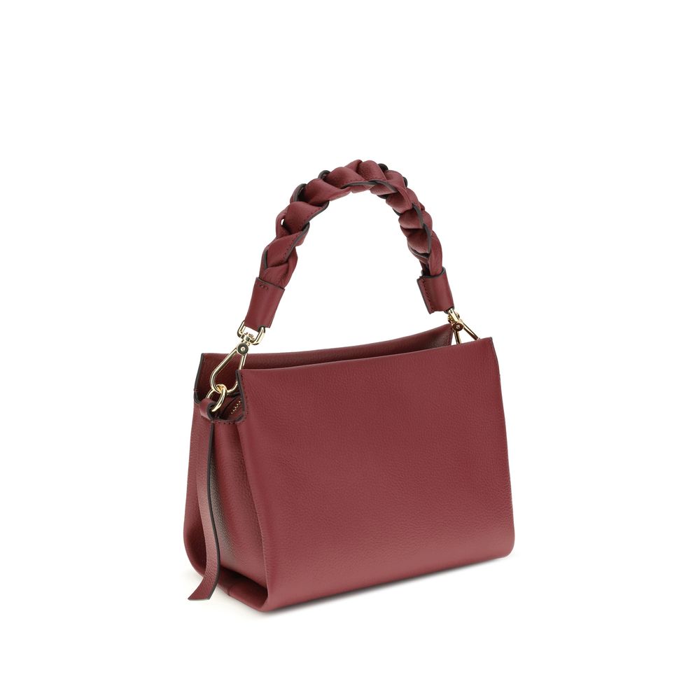 Coccinelle Bordeaux Calf Leather Bos Taurus Shoulder Bag with braided handle and versatile strap, sophisticated garnet leather accessory.