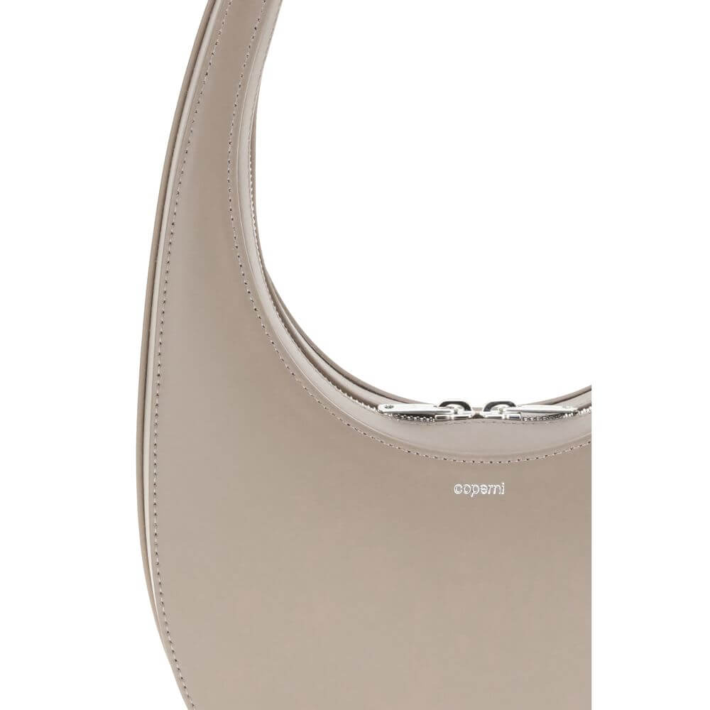 Coperni Beige Leather Shoulder Bag with unique hobo silhouette, featuring a top two-way zip and three-dimensional monogram plaque detail.