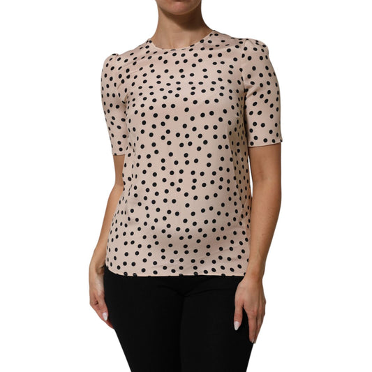 Dolce & Gabbana Beige Black Polka Dot Silk Short Sleeve Blouse Top with round neckline on mannequin.
