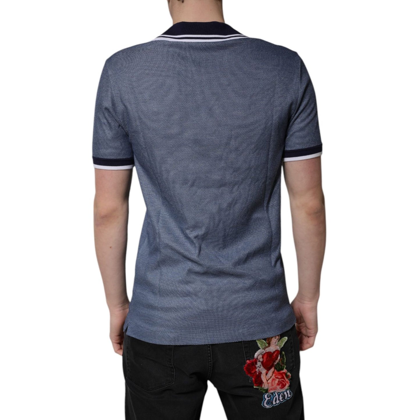 Back view of Dolce & Gabbana Blue Collared V-neck Silk Blend Polo T-shirt on model, showcasing sleek design and premium material.