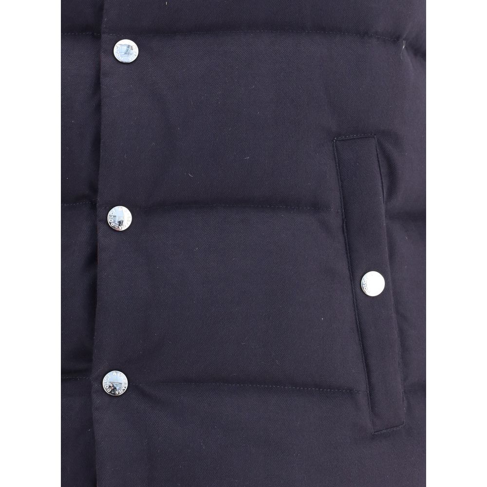 Close-up of Dolce & Gabbana Blue Cotton Jackets And Coat showing snap button closure and buttoned welt pocket with padded design.