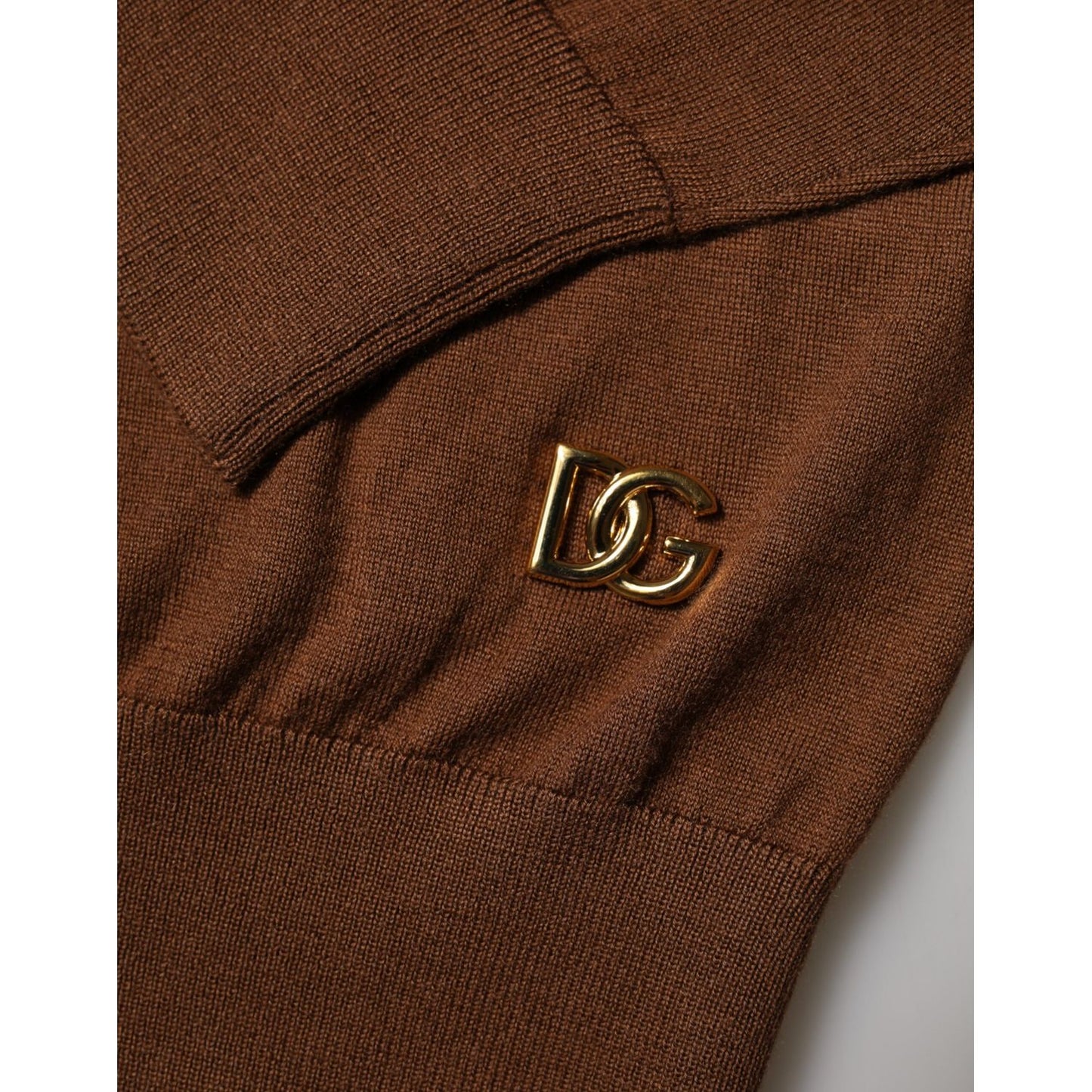 Close-up of Dolce & Gabbana Brown Cashmere Turtle Neck Pullover Sweater with gold logo detail.