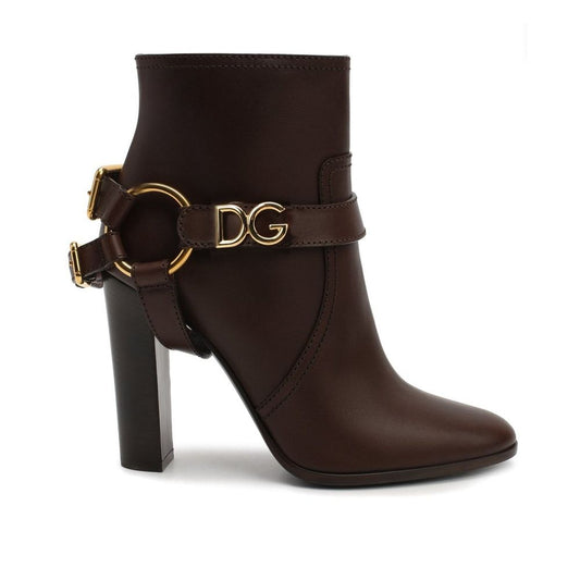 Dolce & Gabbana Brown Leather Ankle Boots with gold logo hardware, round toe, and high heel, made from 100% leather.