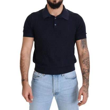 Man wearing Dolce & Gabbana Dark Blue Collared Polo Casual Silk T-shirt paired with jeans, showcasing short sleeves and regular fit.