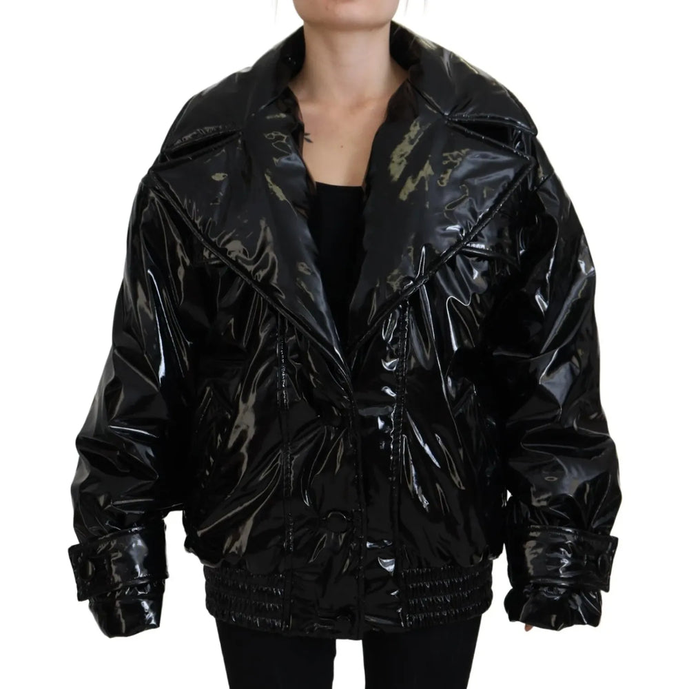 Dolce & Gabbana Polyester Black Shiny Blazer Women Jacket with long sleeves and a replaced button, made in Italy, shown on model.