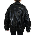 Back view of Dolce & Gabbana Polyester Black Shiny Blazer Women Jacket with long sleeves and replaced button detail.
