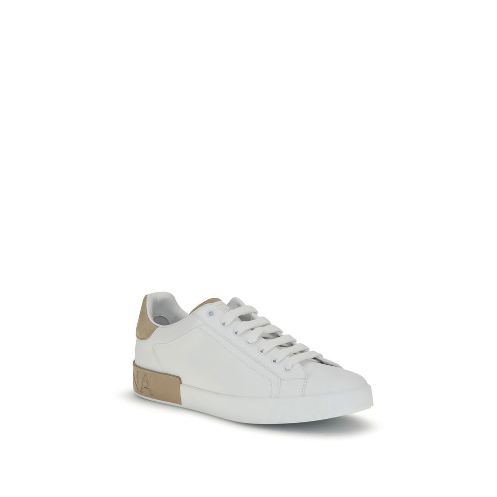 Dolce & Gabbana White Calf Leather Bos Taurus Low Top Sneakers with logo detail, flat sole, lace-up front, and rounded toe.