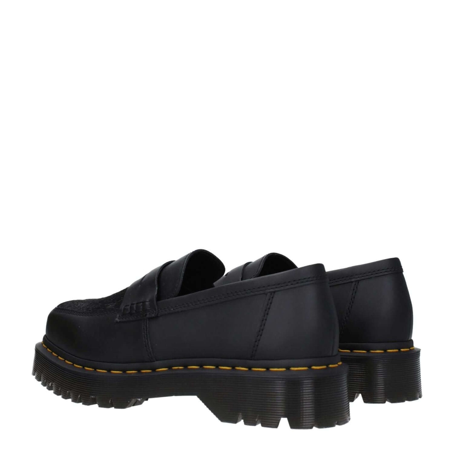 Dr. Martens Black Leather Slip-On Loafers with square toe and mid heels, showcasing durable rubber sole, perfect for casual wear.