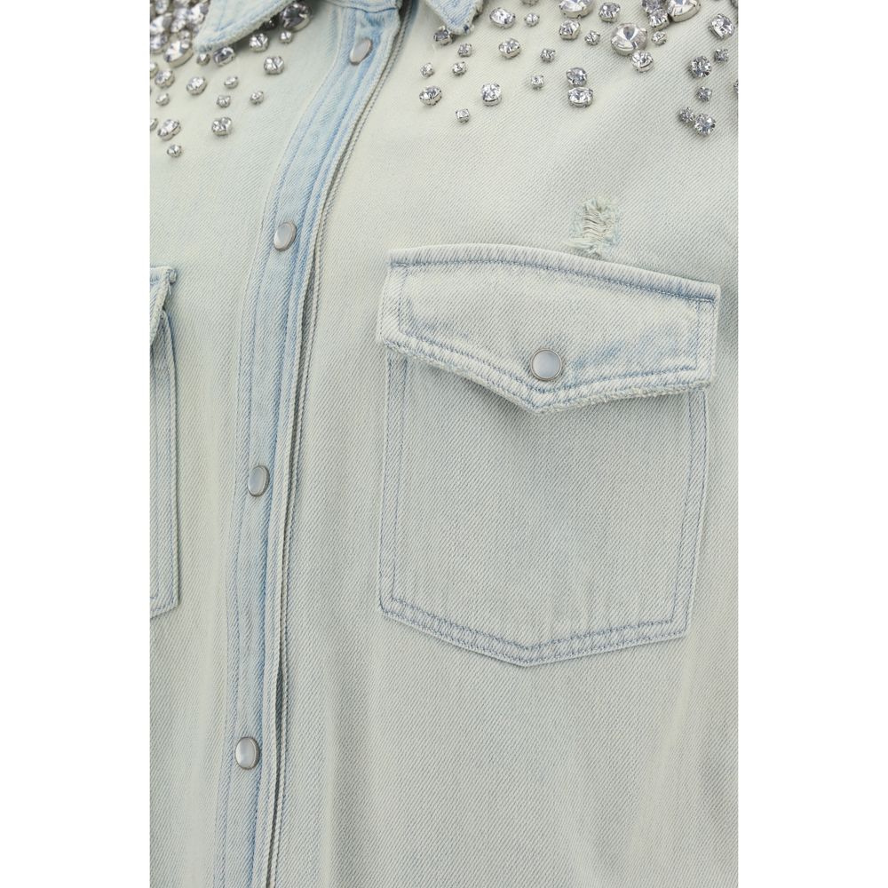Close-up of Golden Goose Blue Denim Shirt featuring beaded appliqués, front patch pockets, and pearl snap closure. AW25 collection.