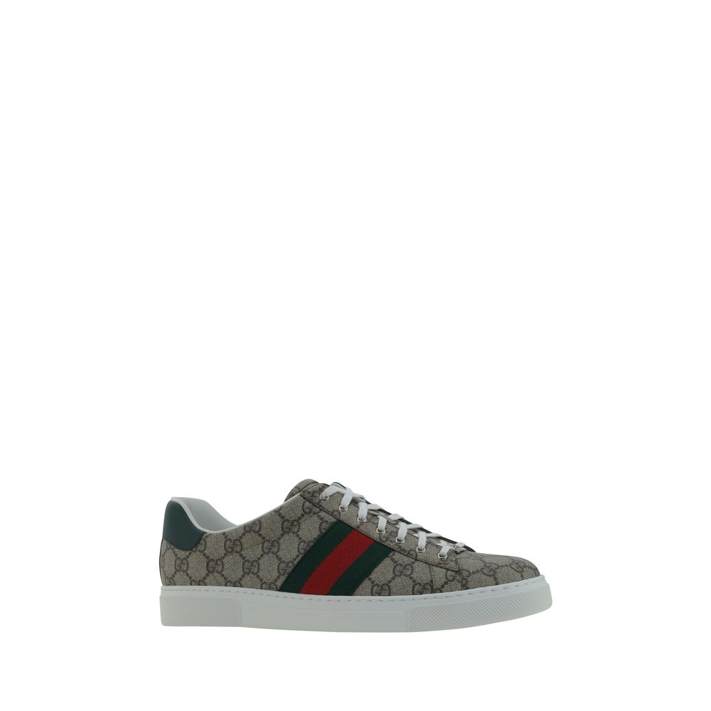 Gucci Beige Rubber Low Top Sneakers with GG jacquard, lace-up closure, platform sole, leather logo detail, and side oblique bands.