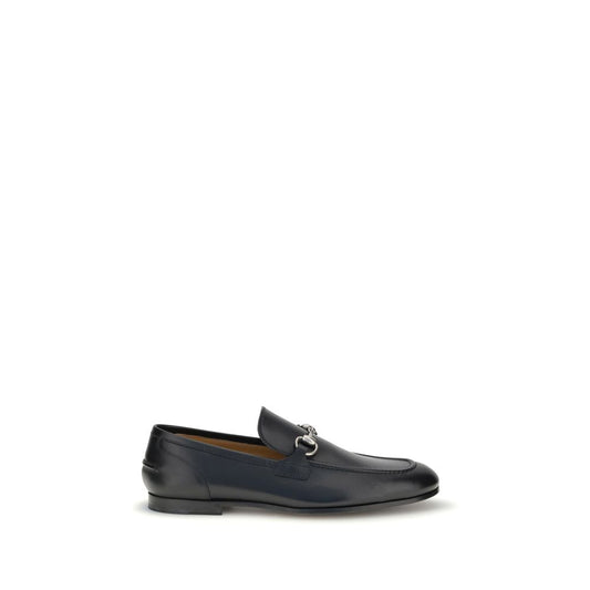 Gucci Black Calf Leather Bos Taurus Slip-On Loafers with metallic Morsetto, round toe, elegant silhouette, ideal for formal and casual wear.