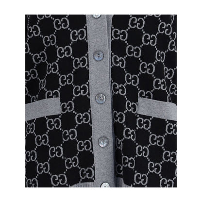 Close-up of Gucci Black Wool Cardigan with GG Supreme pattern, V-neck and buttons, showcasing the versatile design and ribbed trim.