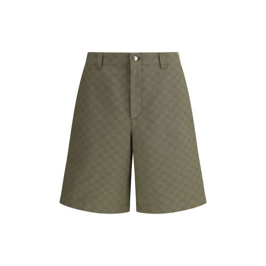 Gucci Green Cotton Bermuda Shorts with GG pattern, front zipper, button closure, and belt loops, perfect for a distinctive casual look.