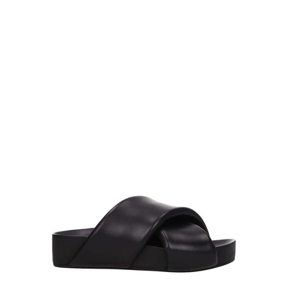 Jil Sander Black Leather Slippers with vintage effect, open toe, mid heel, and casual style for a modern look.