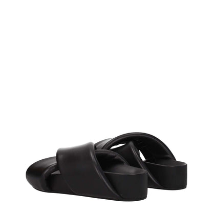 Jil Sander Black Leather Slippers with open toe and mid heel, featuring a vintage effect in casual style.