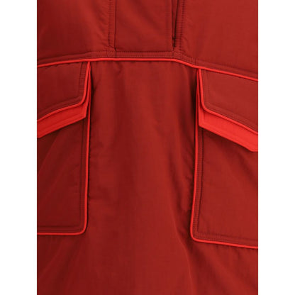 Close-up of MARBELL Red Polyamide Shell Jacket showing its front pockets and stitching details.