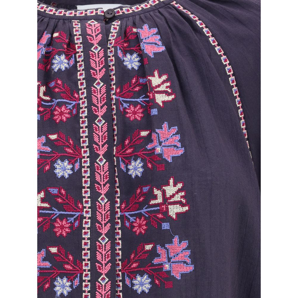 Detailed embroidery on Marant Etoile Blue Cotton Blouse with button closure and raglan sleeves.