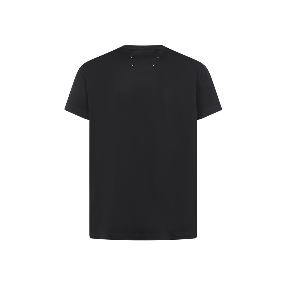 Margiela Black Cotton T-Shirt with embroidered monogram, ribbed crew neck, regular fit for AW25. 100% Cotton by Maison Margiela.