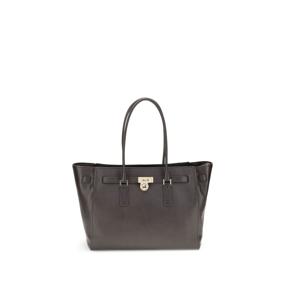Michael Kors Brown Calf Leather Bos Taurus Shoulder Bag with padlock pendant and zippered closure.