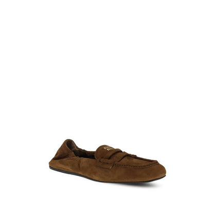 Miu Miu Brown Calf Leather Bos Taurus Slip-On Loafers with suede leather and horsebit design for comfort and style.