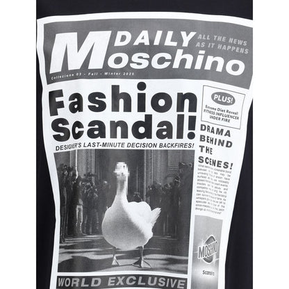 Moschino Black Cotton T-Shirt with newspaper print featuring 'Fashion Scandal!' and duck image, showcasing bold, unique style.