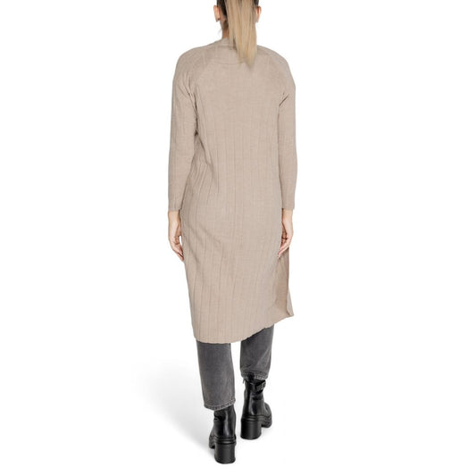 Back view of a model wearing Only Beige Marabou Cardigan, showcasing the long open design, ideal for layering in autumn and winter.